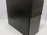 a black desktop computer sitting on top of a white table