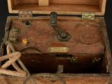 an old wooden box with a handle and a latch on it