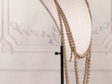 a close up of a mannequin with a necklace on it
