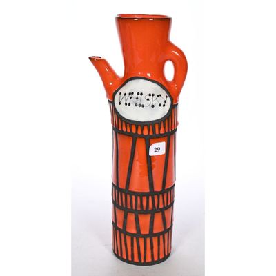 a red vase with a black and white design on it