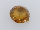a large citrine stone pendant with a gold setting
