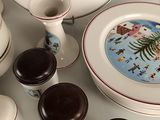 a lot of plates and cups on the table