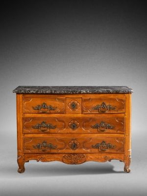 an antique chest of drawers with marble top