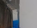 a picture of a window with a blue tape on it
