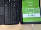 a laptop and a tablet sitting on a desk next to each other