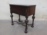 a small wooden table with a drawer on it