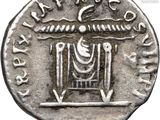 a silver coin with a bird on top of it