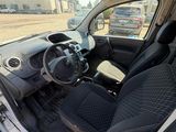 the interior of a small white car with black seats and dashboard