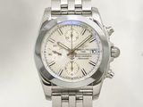a stainless steel watch with a white dial on a white background
