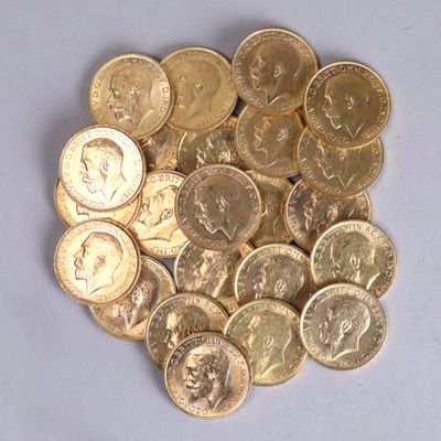 a pile of gold coins sitting on a white surface
