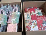 two boxes with christmas cards in them sitting on a table