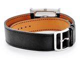 a close up of a black leather bracelet with a silver buckle