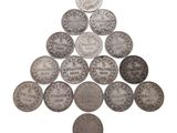 une image représentant un tas de pièces d'argent sur fond blanc