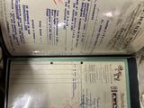 a document with a picture of a man on it sitting in a suitcase