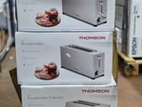 three boxes of toasters stacked on top of each other on a table