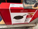 a box with a frying pan on top of it