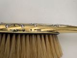 a brush that has a handle on it and a handle on it