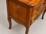 a small wooden table with a drawer on it