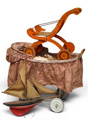 a toy wagon with a toy boat in it on a white background