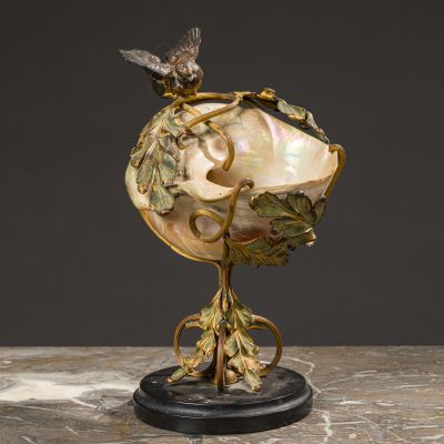 an image of a shell with a bird on top of it