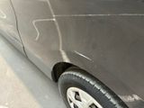 a car that has been painted black with white writing on the side of it