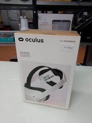 the box is open on the table with the headphones in it