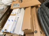 a pile of boxes and hoses sitting on a pallet