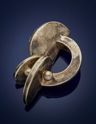 a close up of a metal object on a blue surface