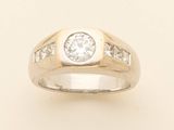 a close up of a diamond ring on a white background