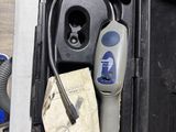 a black box with an electric car charger inside of it