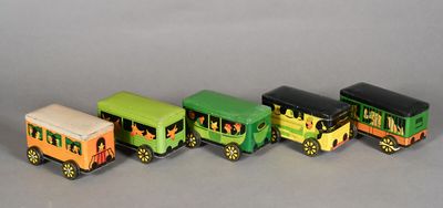 four toy trains that are lined up on the table