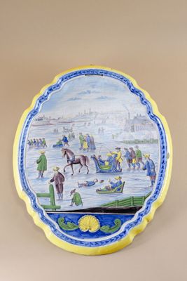 an image of a decorative plate with a painting of people on it