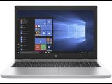 a close up of a laptop on a white surface with windows on the screen