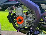 a close up of a motorcycle with a chain attached to it