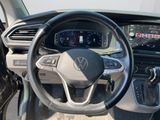 the interior of a car with a steering wheel and dashboard controls