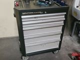 a black and white tool cabinet in a garage