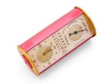 a pink and gold clock sitting on top of a white surface