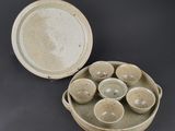 six bowls and a tray that are sitting on a table