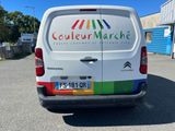 a white van that is parked in a parking lot