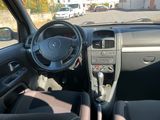 a picture of a car with a steering wheel and dashboard