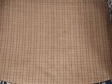 the back of a chair with a blue and white pattern on it
