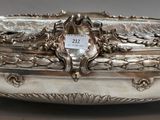 an antique silver plate with a clock on top of it