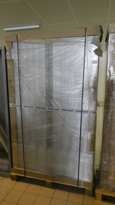 a room that has a lot of glass doors in it