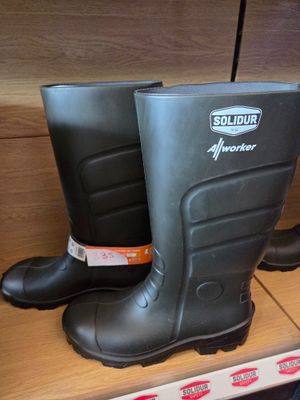 a pair of rubber boots on a shelf in a store