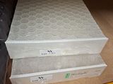 three boxes that are stacked on top of each other