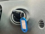 a car door handle with a blue key on it