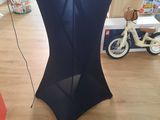 a black table that has a black table cloth on it