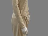 an image of a mannequin dressed in a beige dress