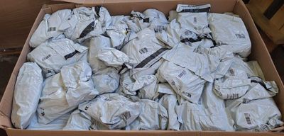 a cardboard box filled with lots of white items
