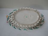 a white plate with a green and white design on it